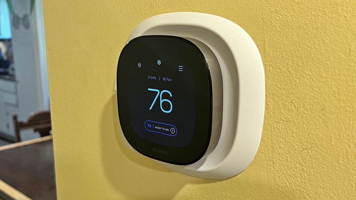 Ecobee smart thermostat on a yellow wall