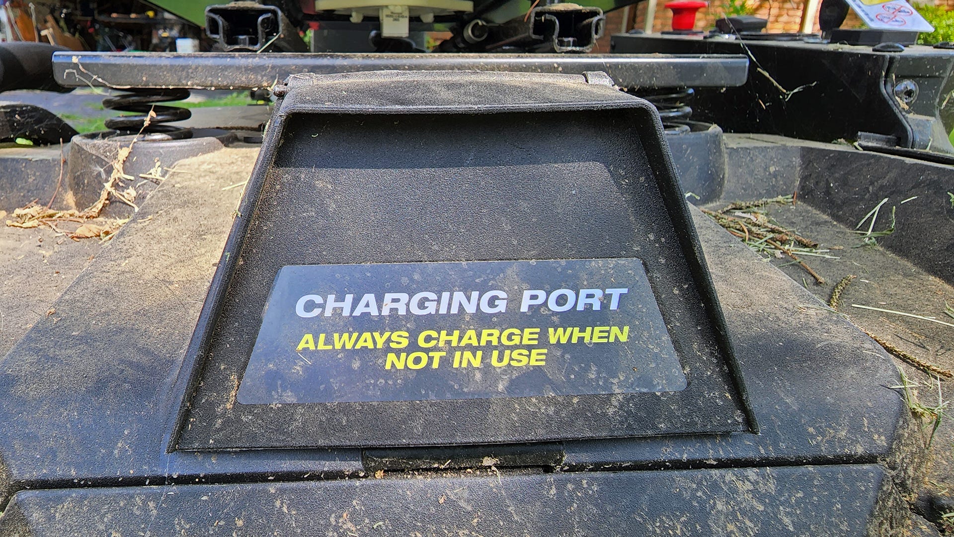 A warning label stating to always charge a mower when not in use