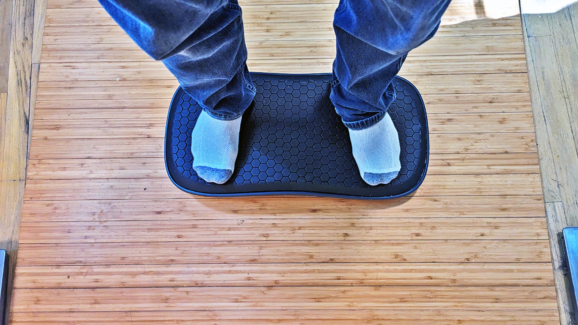 A person standing on a balance board 