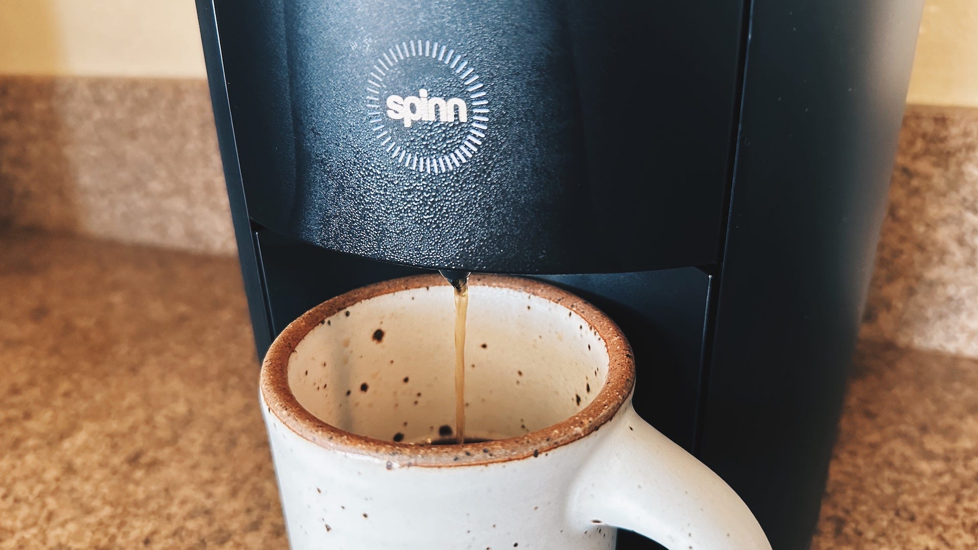 Showing coffee from Spinn dripping into a mug