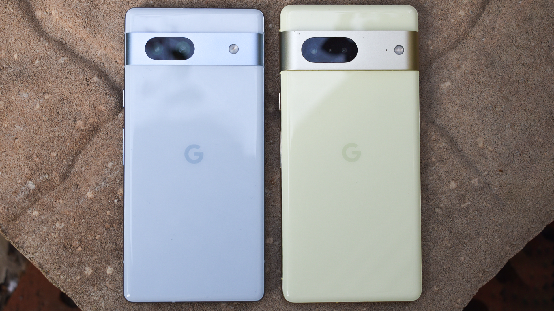 The Google Pixel 7a and Pixel 7 side by side. They are almost the same size.