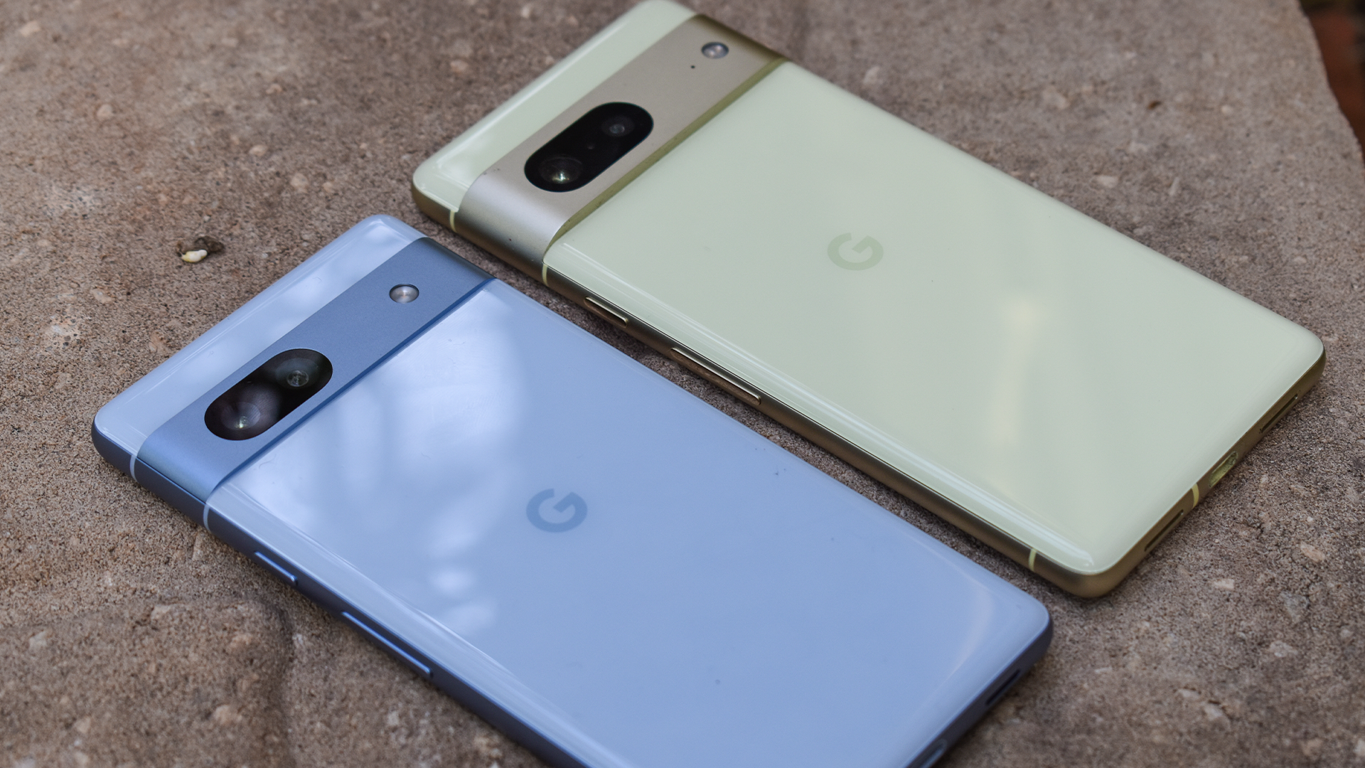 The Google Pixel 7a and Pixel 7 sitting together.