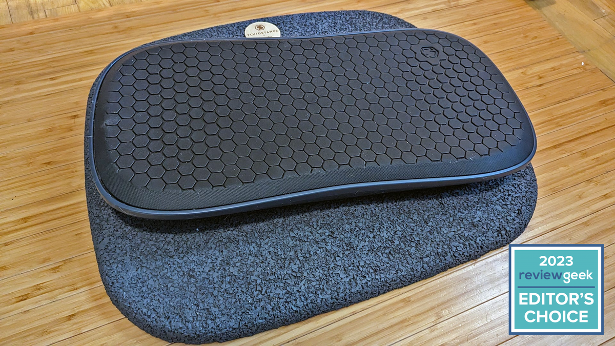 A Fluidstance balance board on top of a anti fatigue mat